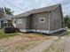 Rear view of the home's exterior, showing the siding, windows, and backyard space at 1033 Cottage Ave, Columbus, IN 47201