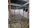 Basement features support beams, concrete floors, and some plumbing at 1033 Cottage Ave, Columbus, IN 47201