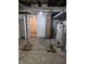 Basement includes utilities like a water heater and plumbing at 1033 Cottage Ave, Columbus, IN 47201