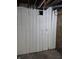 Basement features a storage room and brick walls at 1033 Cottage Ave, Columbus, IN 47201
