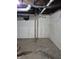 Basement features concrete floors, plumbing, and a window at 1033 Cottage Ave, Columbus, IN 47201