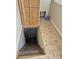 Basement stairs with a chain for support and a wooden hatch to cover the stairwell at 1033 Cottage Ave, Columbus, IN 47201
