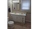 Bright bathroom with double vanity, mirrored medicine cabinet, and neutral color scheme at 1033 Cottage Ave, Columbus, IN 47201