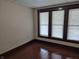 Bedroom featuring hardwood floors and windows offering plenty of natural light at 1033 Cottage Ave, Columbus, IN 47201