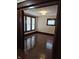 Bedroom features hardwood floors, natural light, and classic ceiling fixture at 1033 Cottage Ave, Columbus, IN 47201