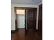 View of a closet with wood trim and a 5-panel door in need of repairs at 1033 Cottage Ave, Columbus, IN 47201