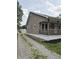 Side view of home, showcasing the driveway and exterior at 1033 Cottage Ave, Columbus, IN 47201