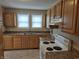 A kitchen featuring wood cabinets and laminate countertops at 1033 Cottage Ave, Columbus, IN 47201