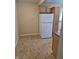 Kitchen area featuring linoleum floors and a large refrigerator at 1033 Cottage Ave, Columbus, IN 47201