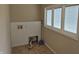 Laundry room features hookups, a window, and space for folding with tile flooring at 1033 Cottage Ave, Columbus, IN 47201