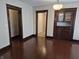 The living room features hardwood floors and access to other areas of the home at 1033 Cottage Ave, Columbus, IN 47201