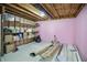 Unfinished basement with exposed beams, shelves, boxes and pink insulation at 10410 Trillium Ct, Noblesville, IN 46060