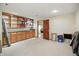 Basement with wooden cabinets, shelving, and open doorway to another area at 10410 Trillium Ct, Noblesville, IN 46060