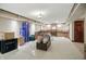 Basement with a fireplace, an area rug, and storage boxes with drinks at 10410 Trillium Ct, Noblesville, IN 46060