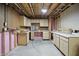 Partially finished basement with cabinets, countertops, and unfinished walls at 10410 Trillium Ct, Noblesville, IN 46060