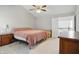 A spacious bedroom with vaulted ceiling, ceiling fan and neutral walls at 10410 Trillium Ct, Noblesville, IN 46060