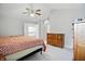 A bright bedroom featuring vaulted ceiling and ceiling fan with plenty of natural light at 10410 Trillium Ct, Noblesville, IN 46060