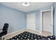 Comfortable bedroom with a black chair, closet and a black-and-white patterned carpet at 10410 Trillium Ct, Noblesville, IN 46060