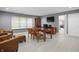 Spacious living room featuring wood floors, plenty of natural light, and office setup at 10410 Trillium Ct, Noblesville, IN 46060