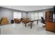 Spacious living room featuring wood floors, plenty of natural light, and office setup at 10410 Trillium Ct, Noblesville, IN 46060
