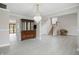 Spacious living room boasts wood-look floors, a chandelier, and an adjacent staircase at 10410 Trillium Ct, Noblesville, IN 46060