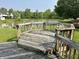 Outdoor deck overlooking a tranquil lake and lush greenery, creating a peaceful retreat for outdoor enjoyment at 10832 Tealpoint Dr, Indianapolis, IN 46229