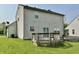 This backyard features a wood deck and ample lawn space, perfect for outdoor relaxation and entertaining at 10832 Tealpoint Dr, Indianapolis, IN 46229