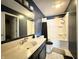 Full bathroom features a tub, shower, vanity, sink, and toilet for all your needs with contrasting blue and white at 10832 Tealpoint Dr, Indianapolis, IN 46229