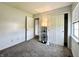 Comfortable bedroom with neutral carpet, closet and a large window at 10832 Tealpoint Dr, Indianapolis, IN 46229