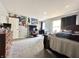 Spacious bedroom featuring a cozy bed, TV, and a collection of colorful posters, creating a personalized space at 10832 Tealpoint Dr, Indianapolis, IN 46229