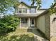 Charming two-story home featuring blue shutters and a welcoming front porch area at 10832 Tealpoint Dr, Indianapolis, IN 46229