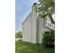Charming two-story home with vinyl siding, a well-maintained yard, and a chimney, nestled near the lake at 10832 Tealpoint Dr, Indianapolis, IN 46229