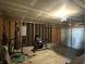 Unfinished garage featuring a punching bag and fitness equipment at 10832 Tealpoint Dr, Indianapolis, IN 46229