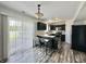 Well-equipped kitchen with stainless steel appliances, dark cabinetry, and a cozy breakfast nook for casual dining at 10832 Tealpoint Dr, Indianapolis, IN 46229