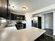 Spacious kitchen with black cabinets, stainless steel appliances, and ample countertop space at 10832 Tealpoint Dr, Indianapolis, IN 46229