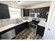 Kitchen featuring stainless steel appliances, modern fixtures and bright countertops at 10832 Tealpoint Dr, Indianapolis, IN 46229