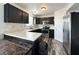 Kitchen featuring black cabinets, stainless steel appliances, and bright counter tops at 10832 Tealpoint Dr, Indianapolis, IN 46229