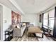 Comfortable living room with contemporary design featuring a comfortable couch, wood flooring, and a wall tapestry at 10832 Tealpoint Dr, Indianapolis, IN 46229
