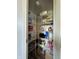 Walk-in pantry filled with an abundance of storage shelves and various items at 10832 Tealpoint Dr, Indianapolis, IN 46229
