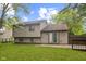Wide shot of home exterior with a fenced in yard and door to concrete patio at 11114 Wismar Dr, Indianapolis, IN 46235