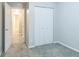 A cozy bedroom with carpet, closet and access to a bathroom at 11114 Wismar Dr, Indianapolis, IN 46235