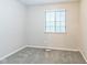 A carpeted bedroom with a window and neutral walls at 11114 Wismar Dr, Indianapolis, IN 46235