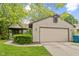 Charming home featuring a two-car garage, mature landscaping, and a well-maintained lawn at 11114 Wismar Dr, Indianapolis, IN 46235