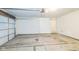 An empty garage with a concrete floor, garage door, and access to the house at 11114 Wismar Dr, Indianapolis, IN 46235