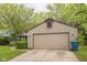 Exterior shot of a well maintained two car garage at 11114 Wismar Dr, Indianapolis, IN 46235