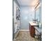 Bathroom featuring a single sink vanity, mirror, and tiled floor at 11303 Cuyahoga Dr, Indianapolis, IN 46235