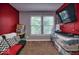 Cozy bedroom featuring a large window with natural light and comfortable futon at 11303 Cuyahoga Dr, Indianapolis, IN 46235