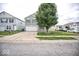 Front exterior view of a two-story home with gray siding and a concrete driveway at 11303 Cuyahoga Dr, Indianapolis, IN 46235