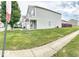 Side view of a two-story house with a well-manicured lawn at 11303 Cuyahoga Dr, Indianapolis, IN 46235