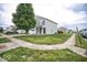 Street view of a two-story house with well-kept lawn and sidewalk at 11303 Cuyahoga Dr, Indianapolis, IN 46235